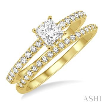 Lady's Yellow 14 Karat Wedding Set one = 0.375ct Princess Diamond
= 0